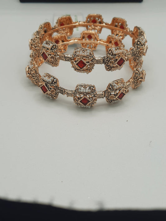 A pair of 2 Bangle 2.80 size in shades of golden and red - NATASHAHS