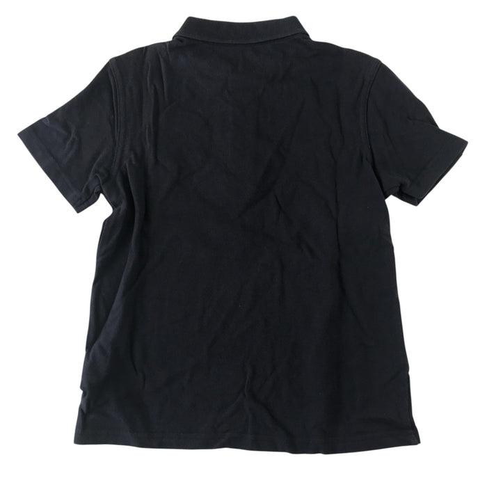 Second-hand Alexandra Parade Primary School navy polo shirt with plain collar and embroidered badge, flat lay view.