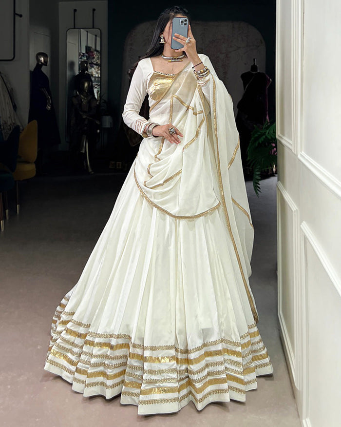 Alluring White Mirror Laced Navratri Wear Lehenga With Peplum Top