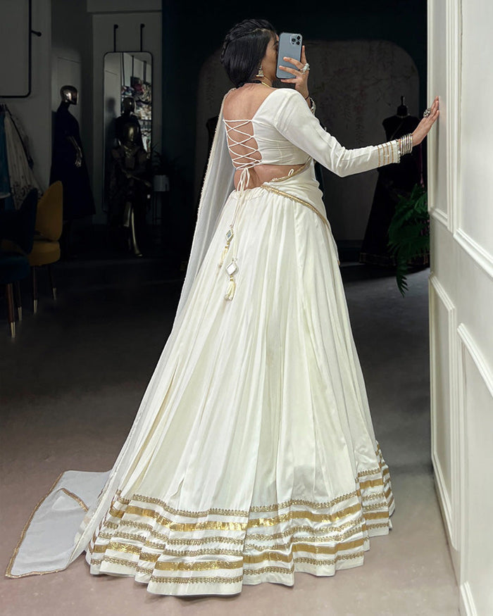 Alluring White Mirror Laced Navratri Wear Lehenga With Peplum Top