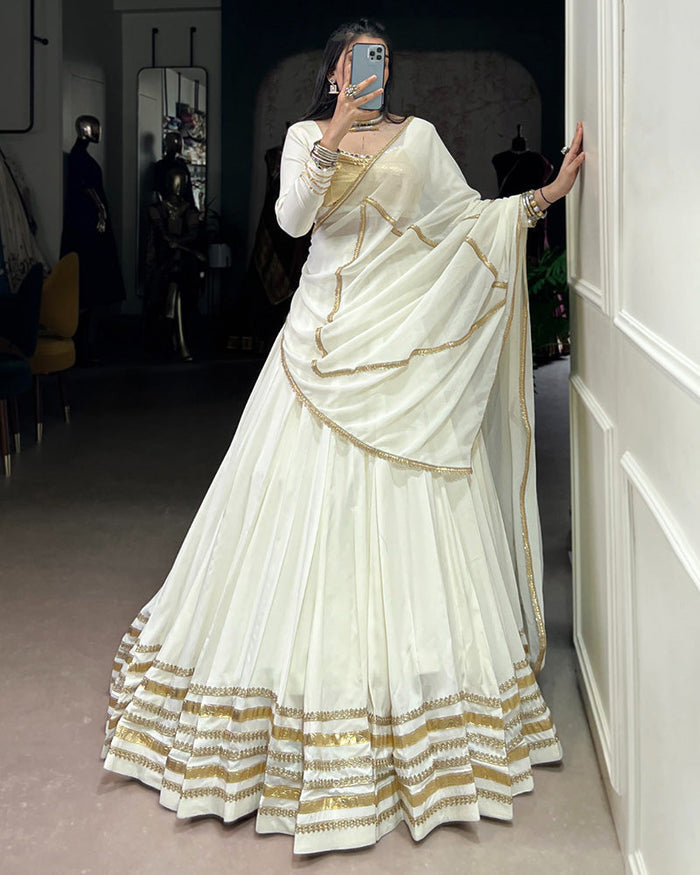 Alluring White Mirror Laced Navratri Wear Lehenga With Peplum Top