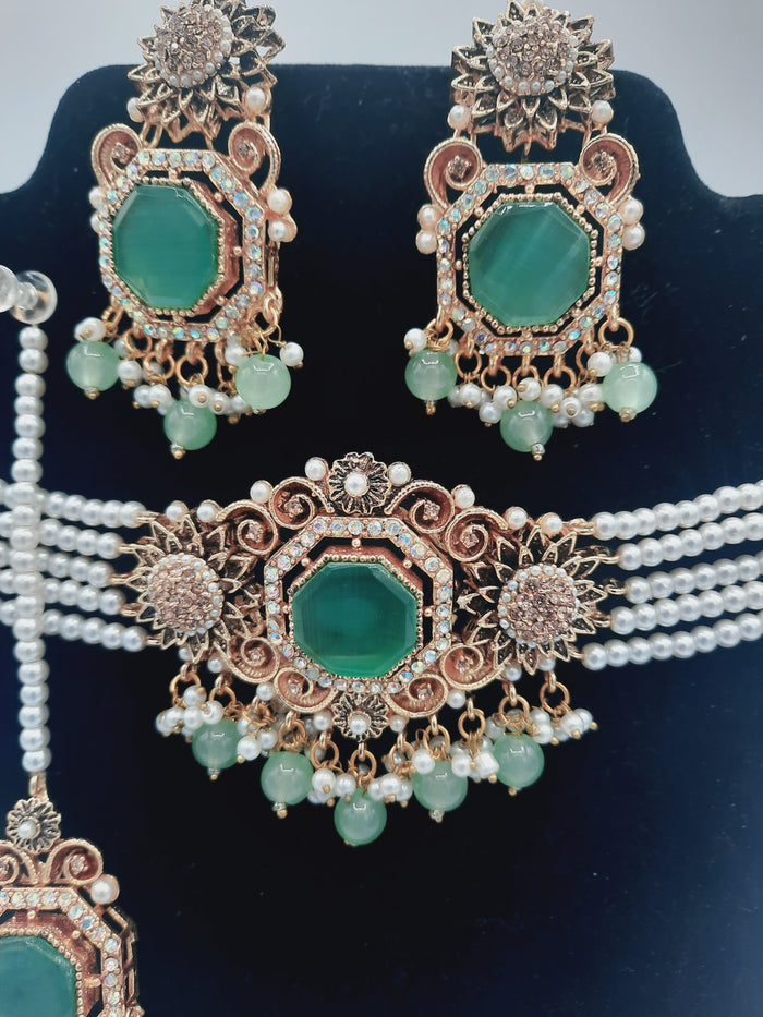Anarkali Zircon choker set with guluband earrings and teeka in green color - NATASHAHS