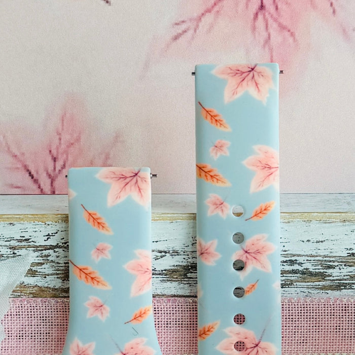 Both sizes of the Autumn Breeze Samsung Galaxy Watch band side by side, close view of the blush maple leaves and coral wheat sprigs.