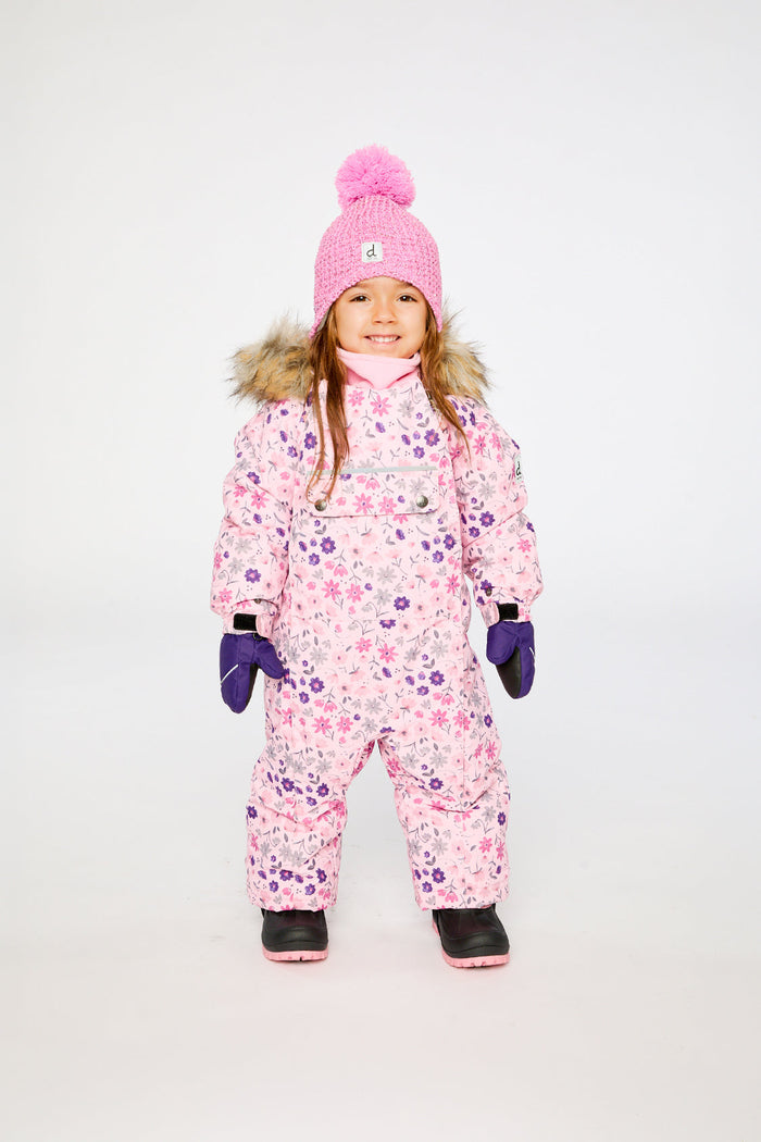 Child standing in the pink mini flower print Deux par Deux one-piece snowsuit, front view
