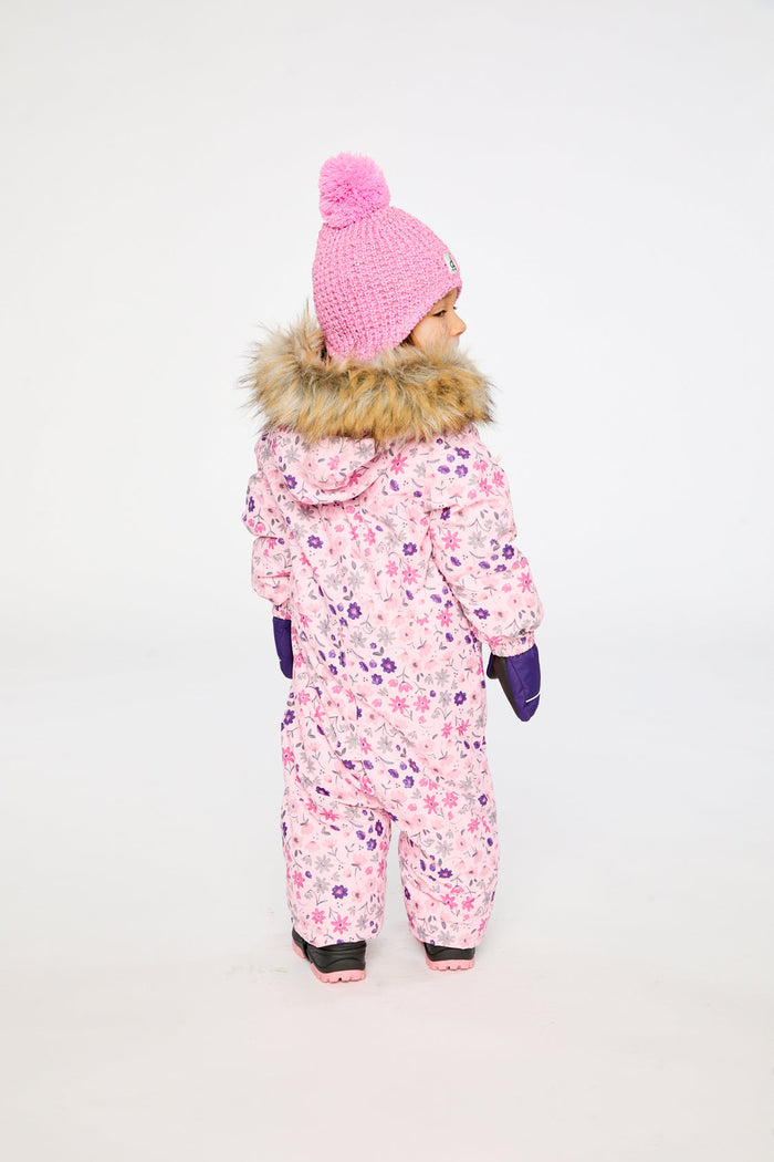 Back view of a child in the pink mini flower print snowsuit with faux-fur trimmed hood