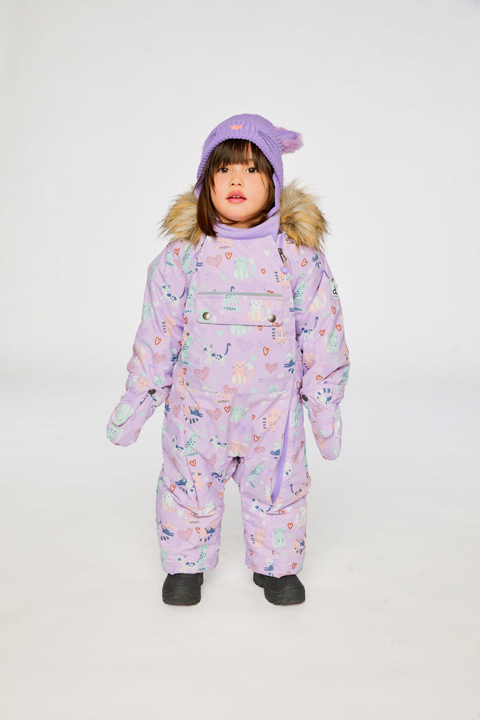 Child standing in the purple cat print Deux par Deux one-piece snowsuit, front view