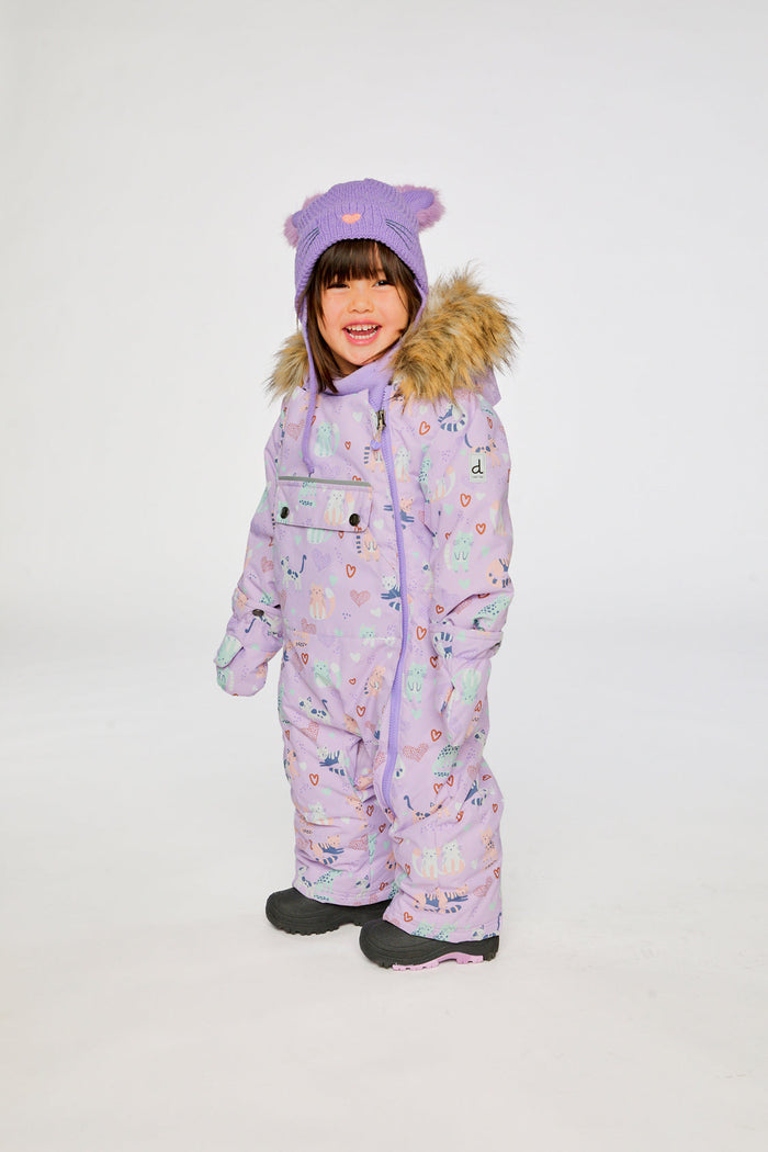 Side view of a child wearing the purple cat print car seat snowsuit