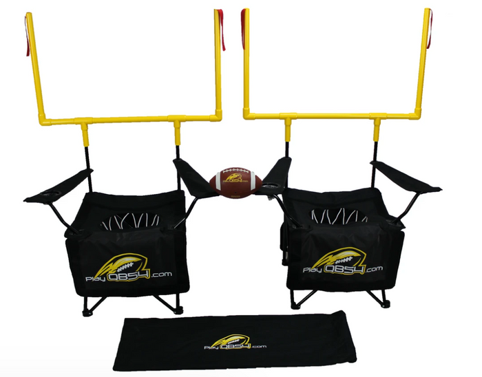A black game set designed for St Patrick's Day, featuring two football goal posts with yellow detailing, and two black chairs with the QB54 logo.