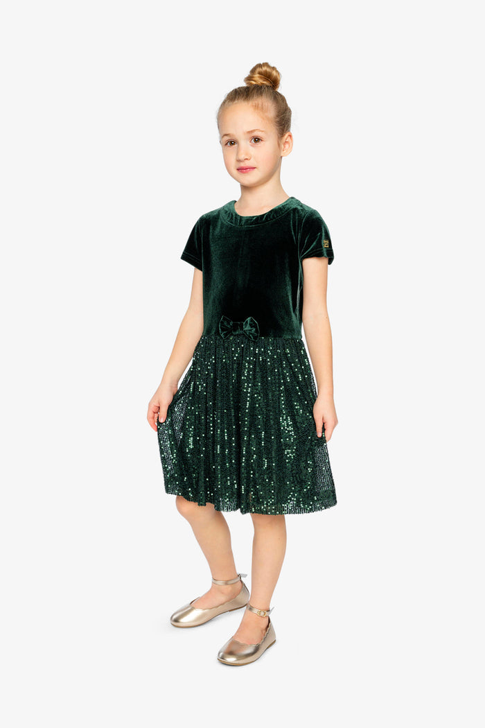 Child wearing Deux par Deux Green Forest velvet dress with glittering mesh skirt, lookbook view 1
