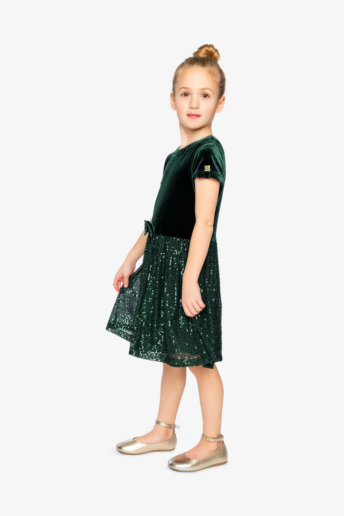 Child wearing Deux par Deux Green Forest velvet dress with glittering mesh skirt, lookbook view 2