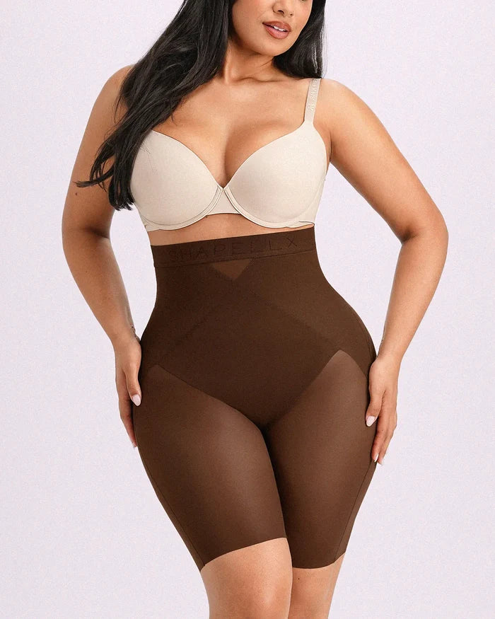 Model wearing brown high-waisted shorts engineered with targeted X-mesh belly flattening and airy cooling comfort.