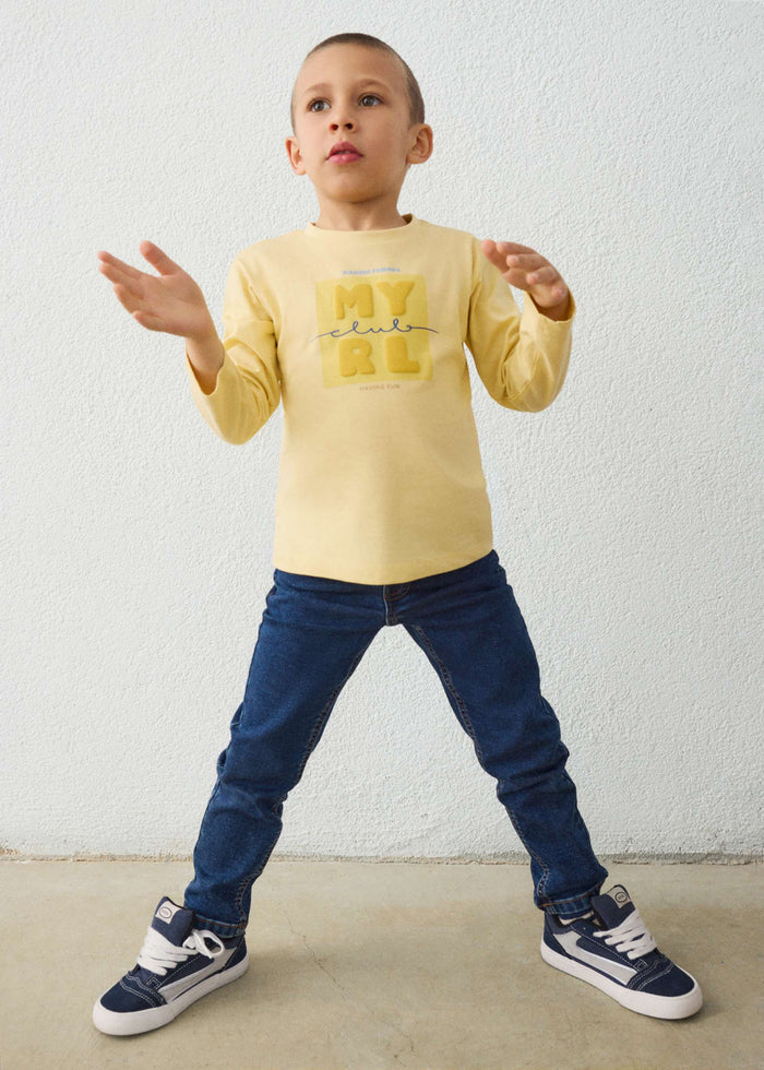 Child wearing the dark wash Mayoral jeans, front view