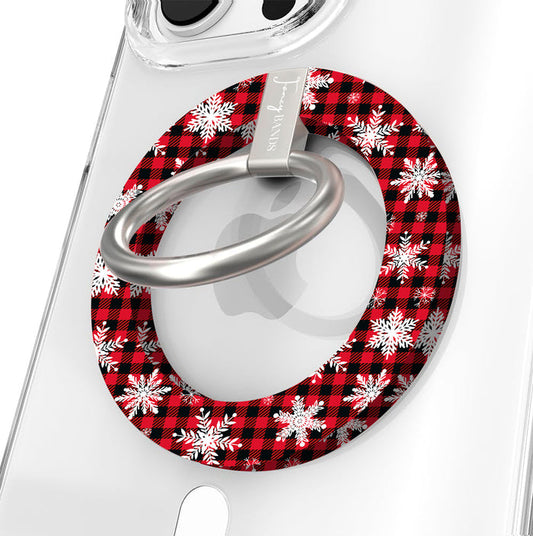 Close-up of the Buffalo Plaid Snowflake MagSafe grip ring, red and black buffalo check with white snowflakes, with brushed silver ring on a clear iPhone case