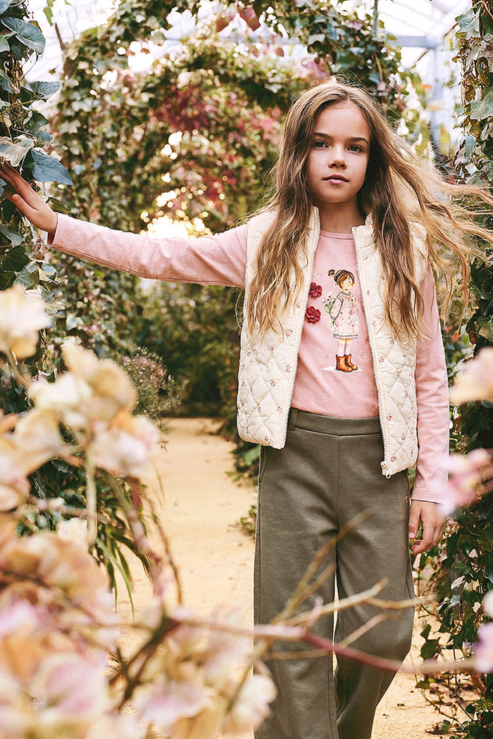 Child wearing the beige floral corduroy puffy vest by Deux par Deux