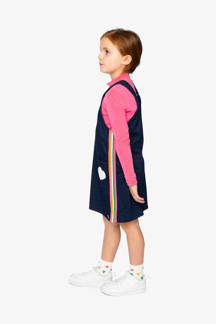 Deux par Deux girls' navy denim-look French terry overall dress – on a child model, side view