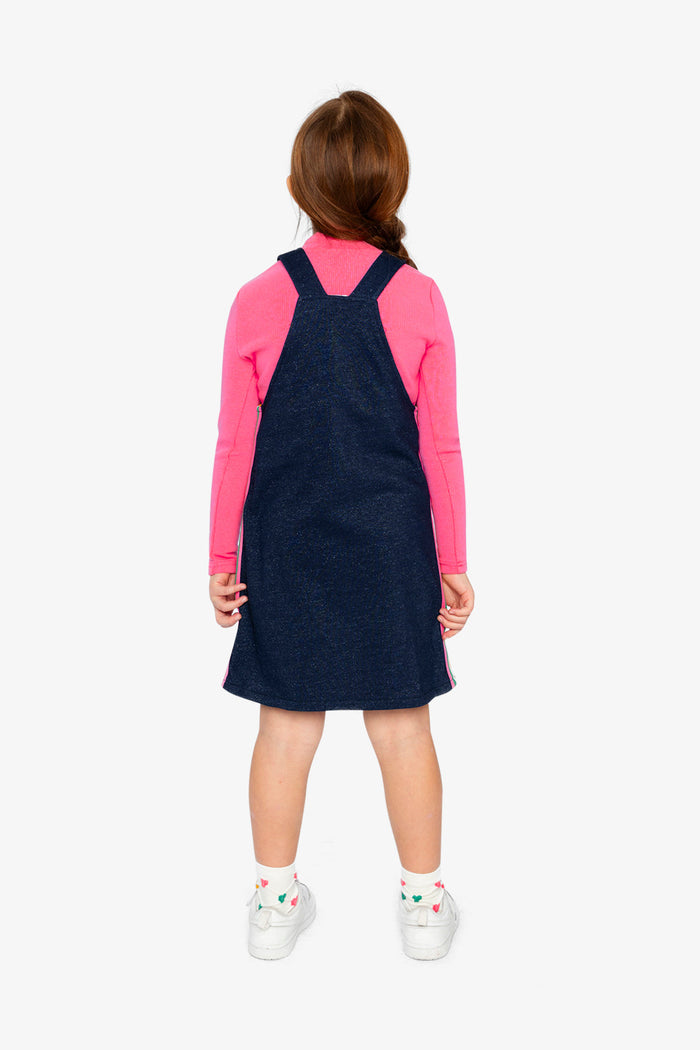 Deux par Deux girls' navy denim-look French terry overall dress – on a child model, back view