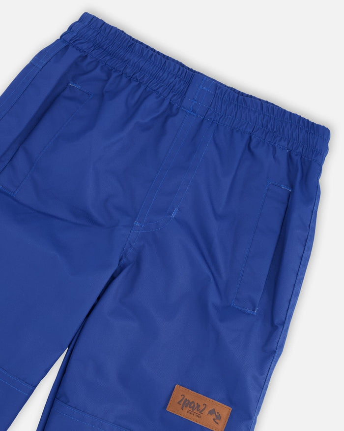 Deux par Deux boys' insulated mid-season set, blue and brown gradient jacket with blue pants – pants waistband and logo label close-up