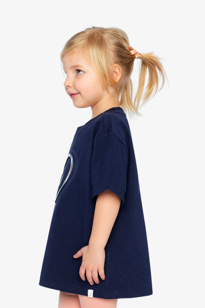 Deux par Deux girls' dark blue jersey T-shirt with holographic heart – on a child model, side view