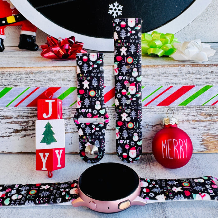 Jolly Wrist-mas Samsung Galaxy Watch band attached to a rose gold Galaxy Watch with JOY blocks and a Merry ornament