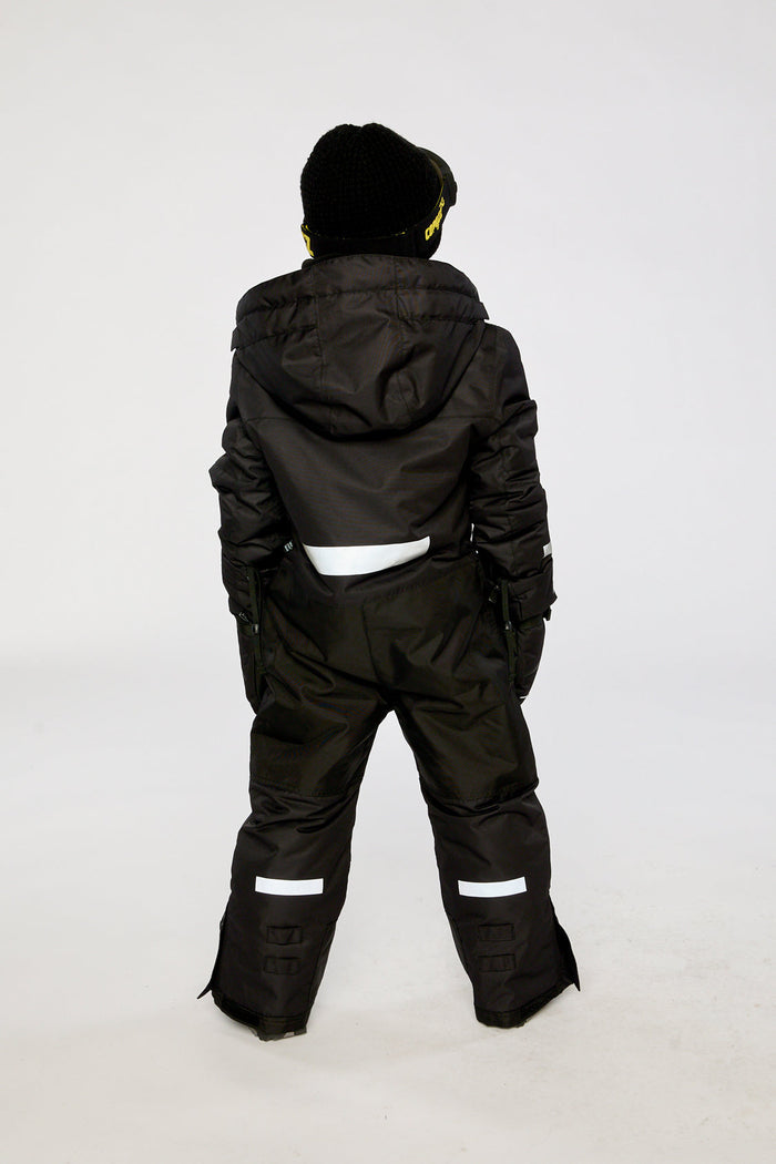 Child wearing the black Deux par Deux TEKNIK one-piece snowsuit, back view
