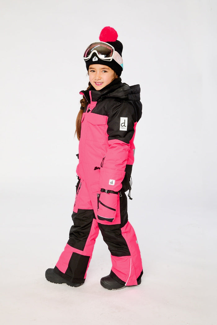 Child wearing the bright pink Deux par Deux TEKNIK one-piece snowsuit, side view