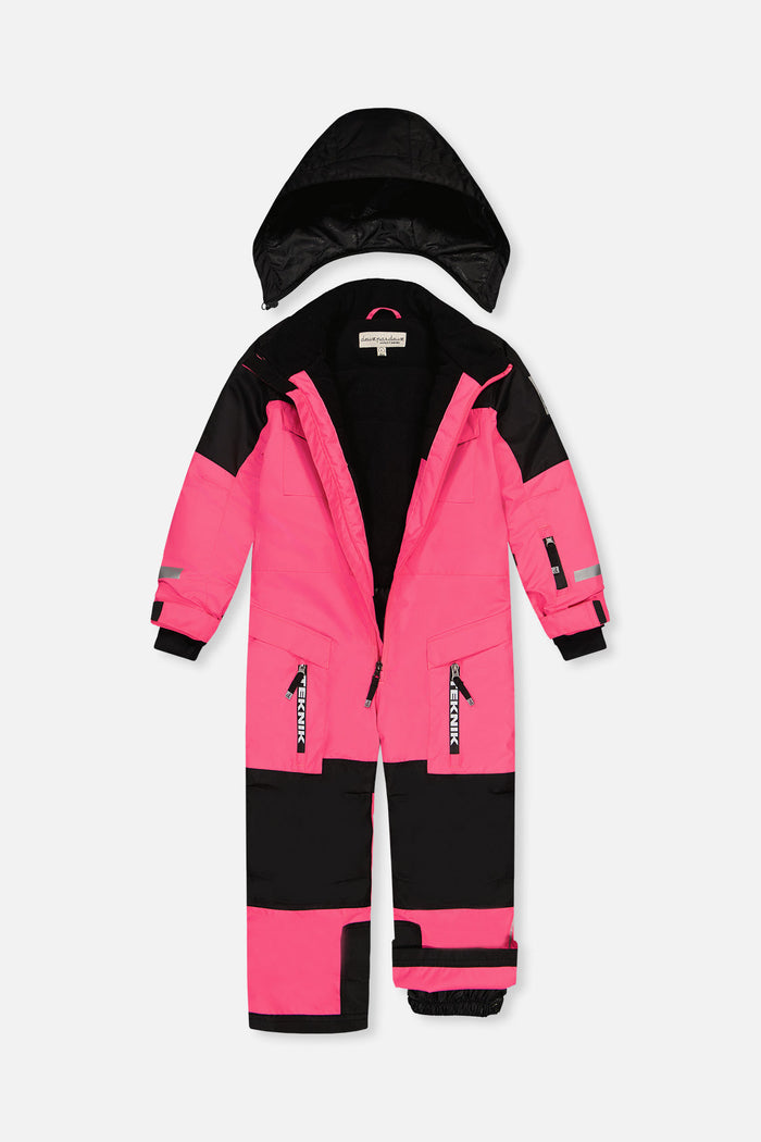 Bright pink TEKNIK one-piece snowsuit unzipped with the black hood detached, showing the lining