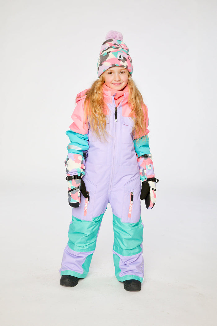 Child wearing the lavender, turquoise and orange Deux par Deux TEKNIK one-piece snowsuit, front view