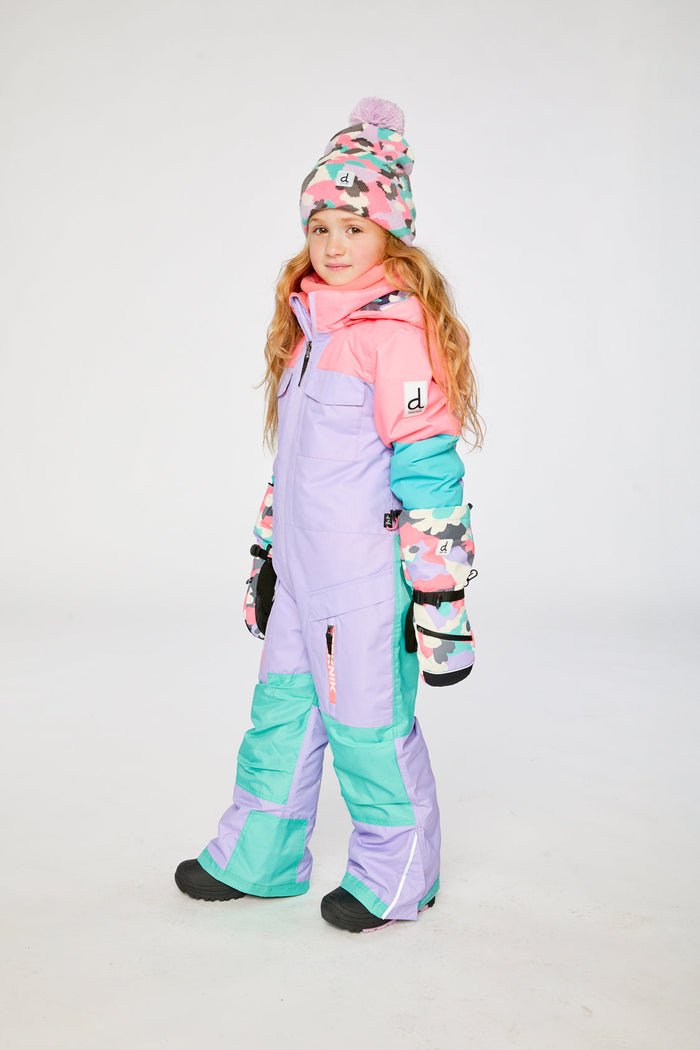 Child wearing the lavender, turquoise and orange Deux par Deux TEKNIK one-piece snowsuit, side view