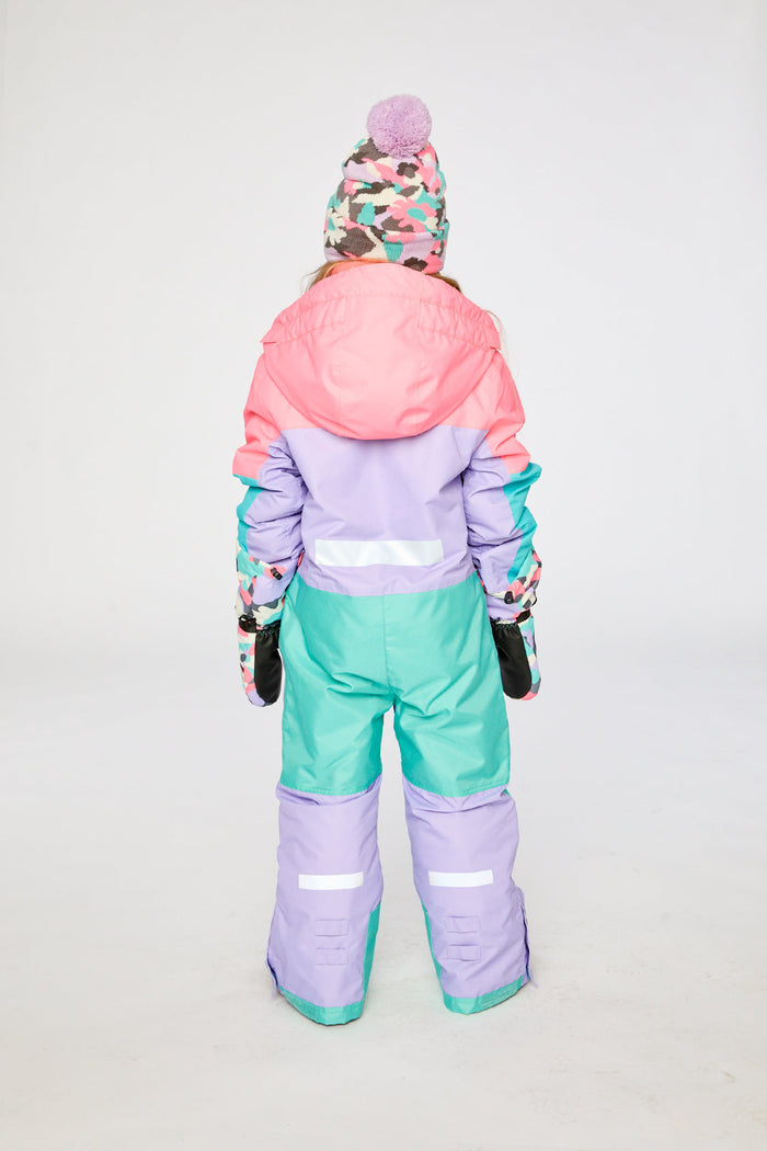 Child wearing the lavender, turquoise and orange Deux par Deux TEKNIK one-piece snowsuit, back view