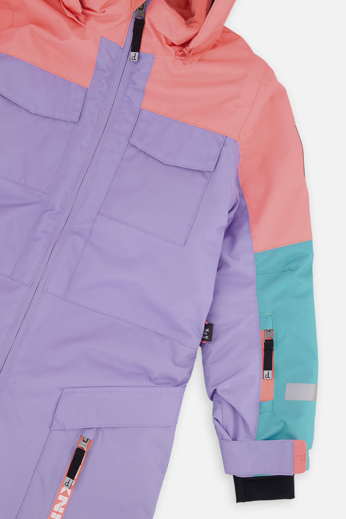 Close-up of the lavender chest pocket, orange shoulder and turquoise sleeve on the TEKNIK snowsuit