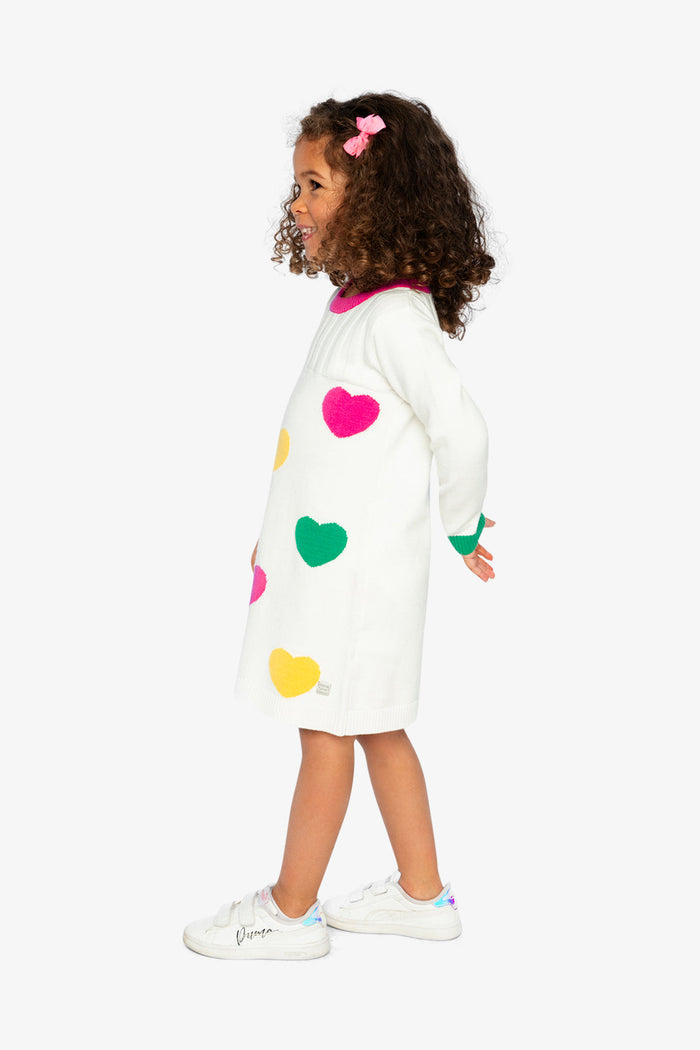 Deux par Deux girls' heart jacquard knit dress in off-white, green and pink – on a child model, side view