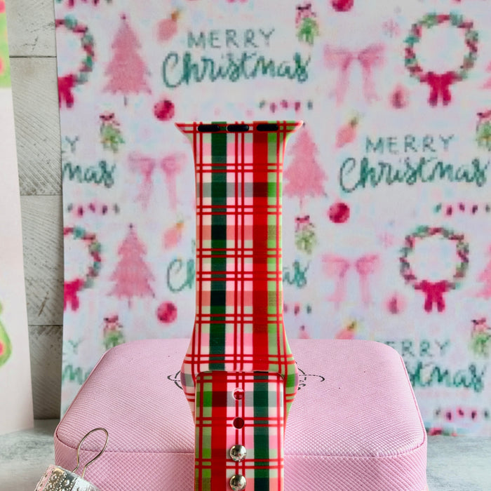 Close-up of the Merry Little Plaid Apple Watch band showing the pink, cherry red and evergreen plaid