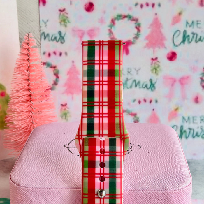 Close-up of the Merry Little Plaid Samsung watch band showing the pink, cherry red and evergreen plaid