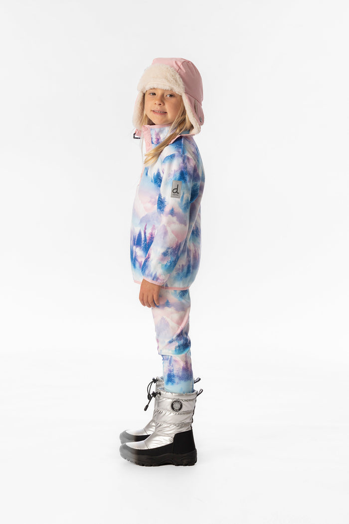 Deux par Deux girls' plush fleece snap-front pullover in blue and pink mountain print – on a child model, side view