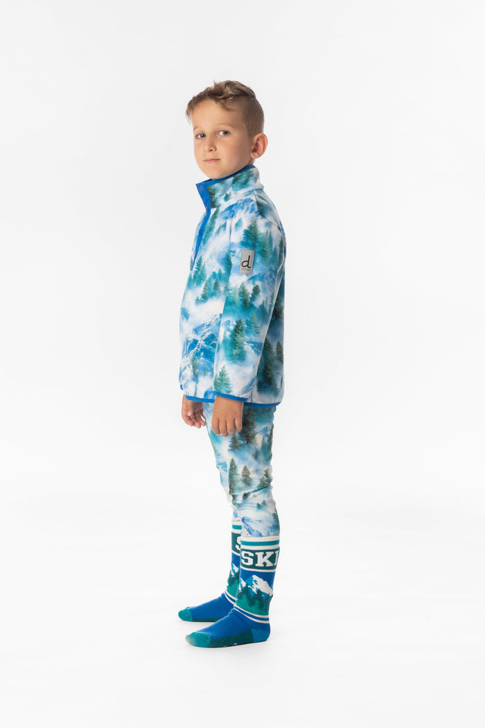 Deux par Deux boys' plush fleece snap-front pullover in blue mountain print – on a child model, side view