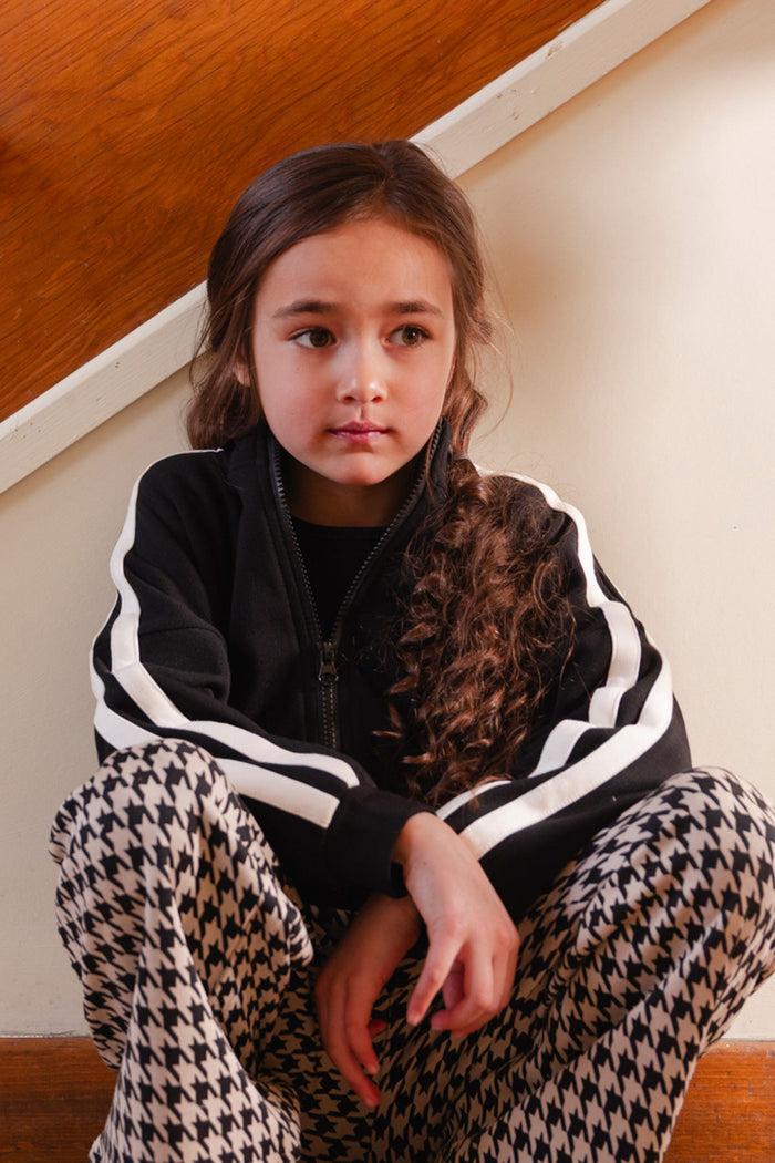 Child wearing the Deux par Deux black milano zip jacket, view 2