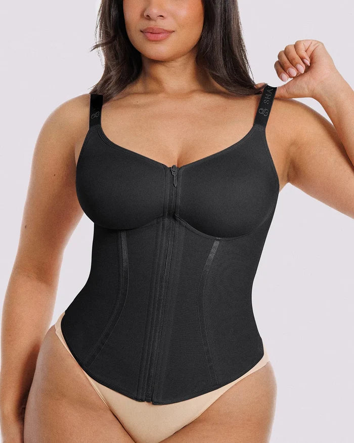 Fitted black shaping corset top creating a defined waist silhouette