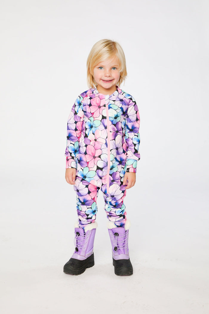 Child wearing the purple floral print one piece thermal underwear, view 2