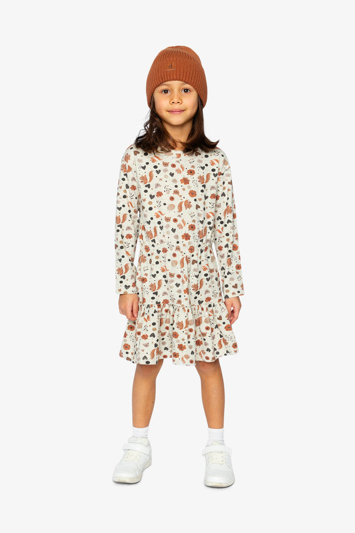 Child wearing Deux par Deux organic cotton dress, beige squirrel print, lookbook view 1