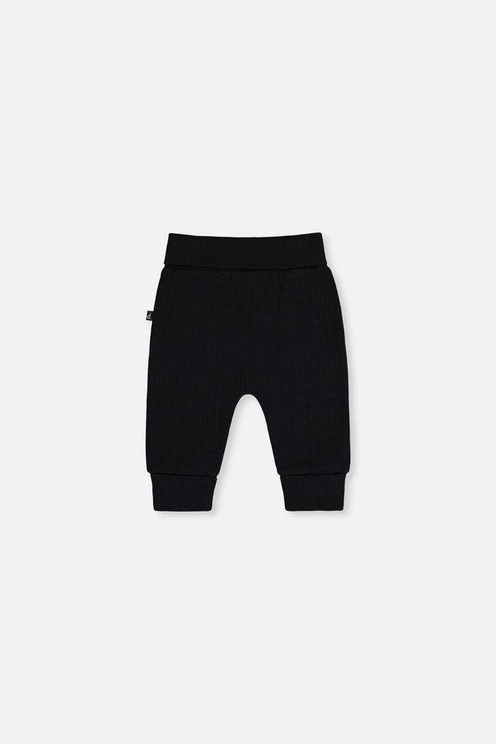 Deux par Deux baby evolutive pants, black and brown with hedgehog details, back view