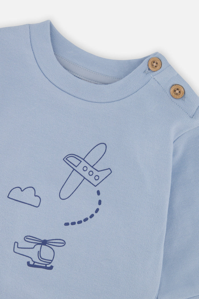 Close-up detail of the Deux par Deux set with sky blue top and deeper blue airplane and cloud print pants, view 4