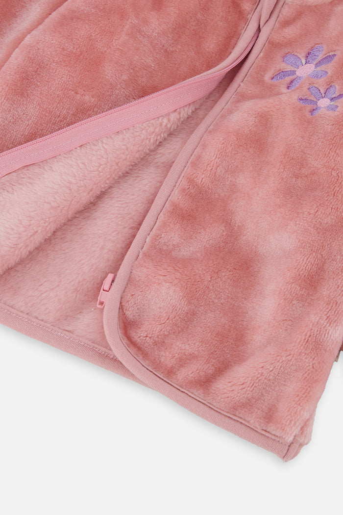 Close-up of the soft dusty pink plush fabric and full-length zipper edge