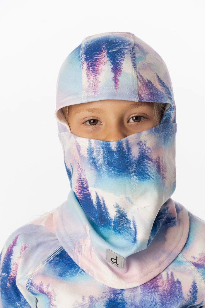 Deux par Deux girls' polar fleece balaclava in blue and pink mountain print – worn by a child model