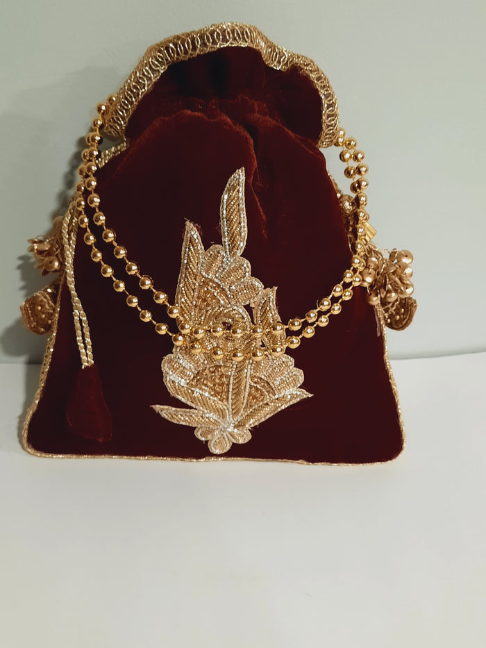 Red clutch for weddings and parties with golden chain