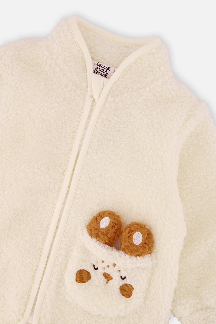 Close-up of the stand-up collar, full zip and bunny pocket on the off-white baby sherpa jacket