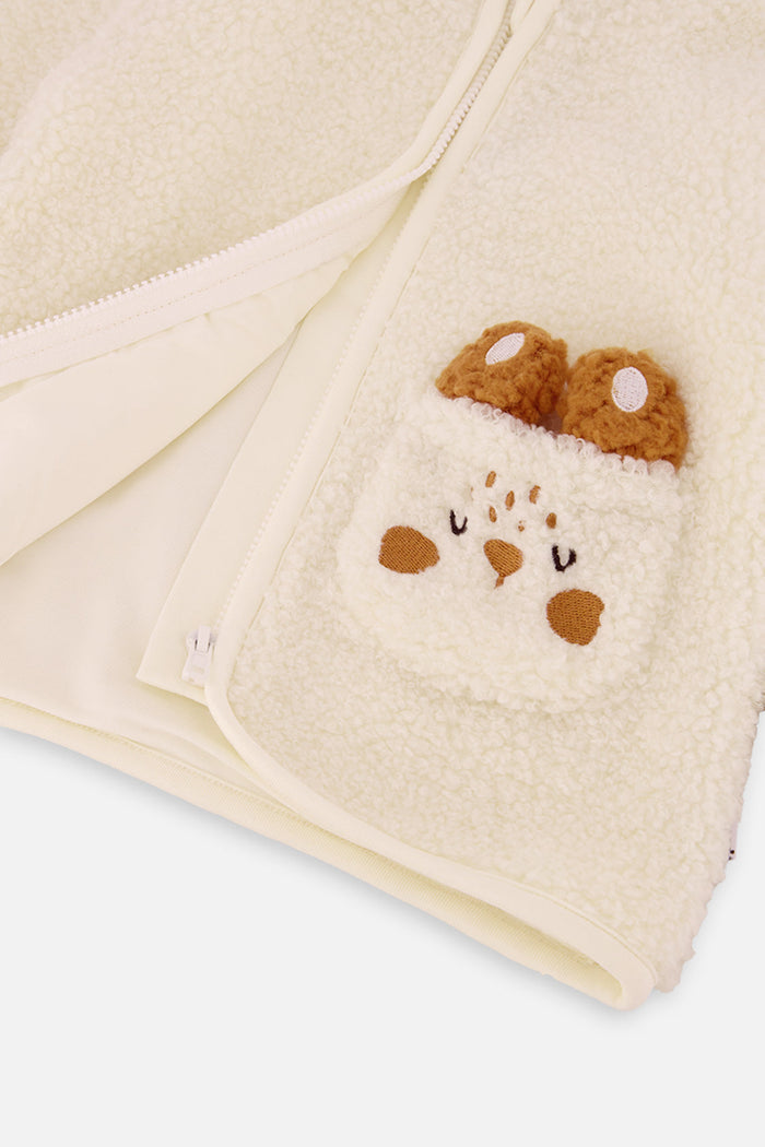 Close-up of the bunny chest pocket with plush ears on the Deux par Deux baby sherpa jacket
