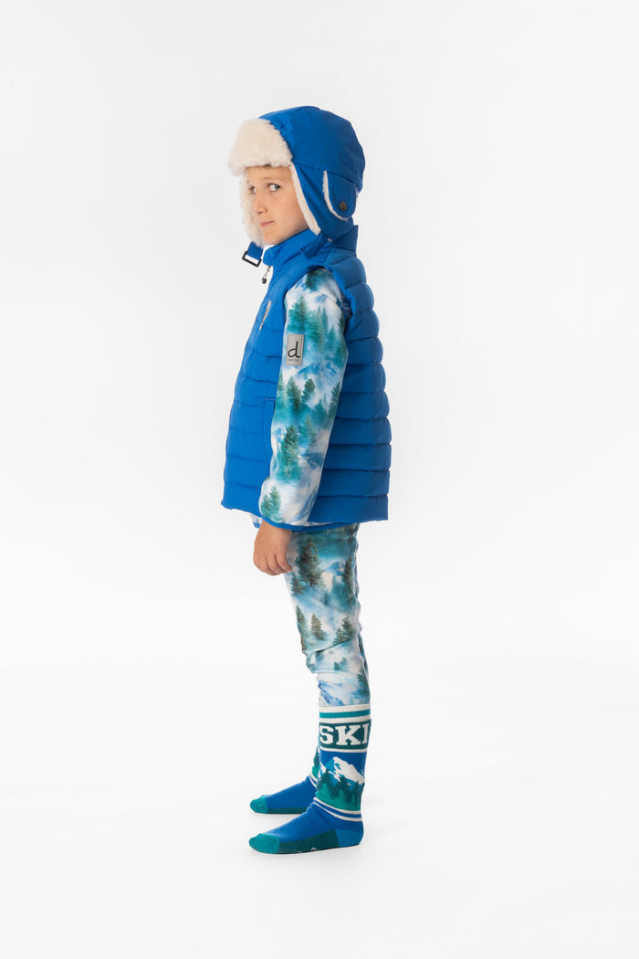Child wearing the blue quilted Deux par Deux vest, side view