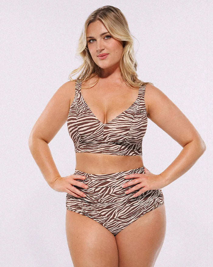 Model wearing Smart Sculpt Ruched V-Neck Bikini Top and High-Waisted Bottom Set, showing tummy-smoothing fit