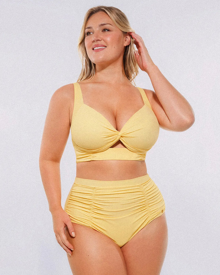 Model wearing twist-front cream yellow bikini set with high-waisted tummy control bottoms