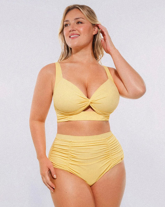 Model wearing twist-front cream yellow bikini set with high-waisted tummy control bottoms